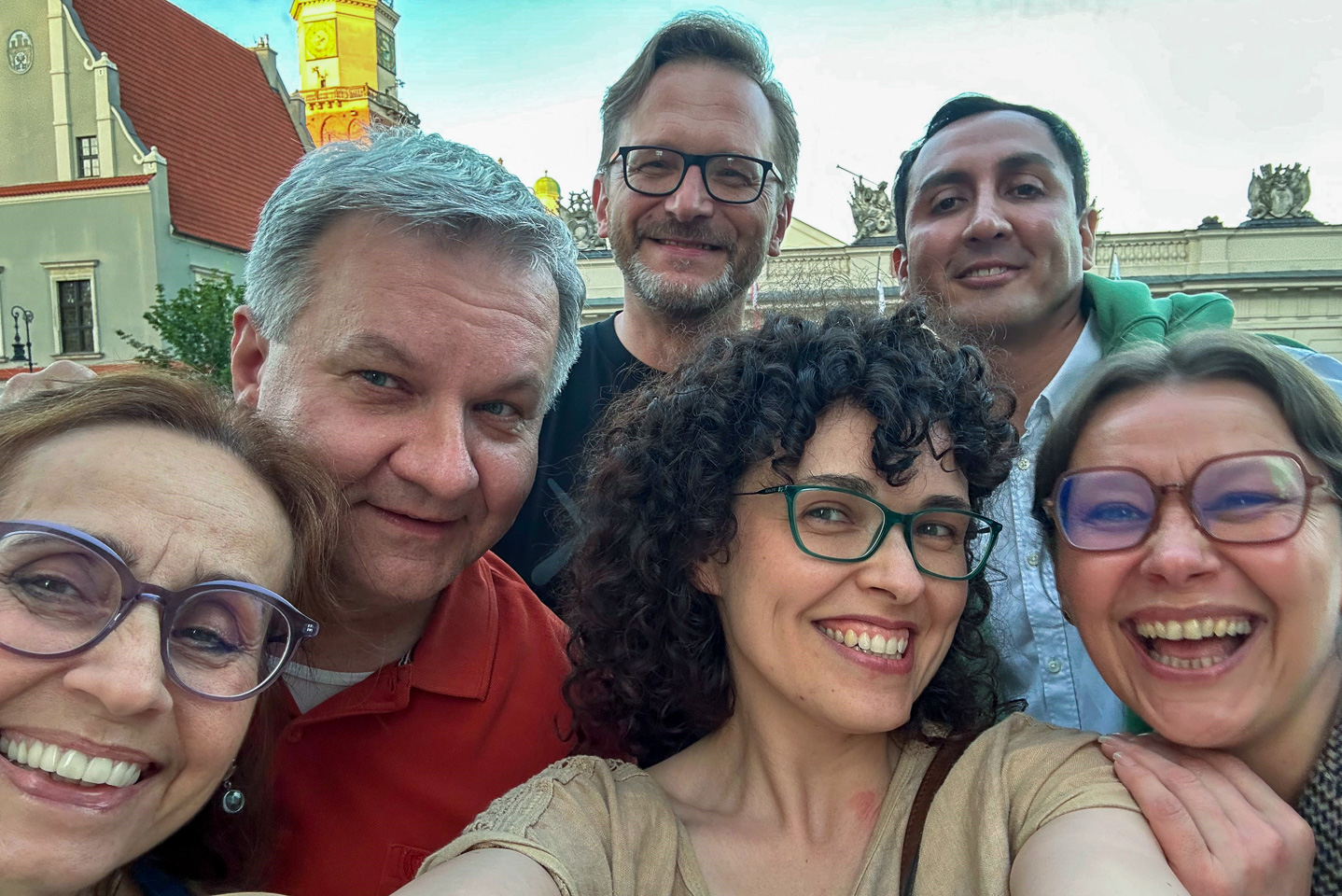 photograph: six persons pose for a photograph
