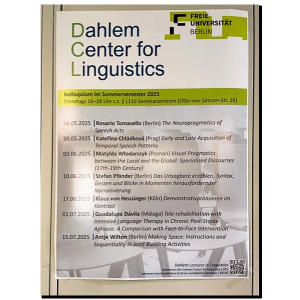 photograph: poster with a conference programme listing the talk discussed in the article