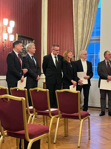 photograph: a group of people at a formal ceremony