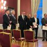 photograph: a group of people at a formal ceremony