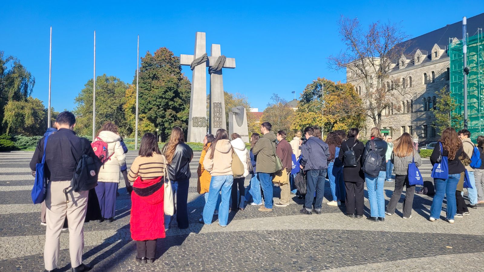 photograph: group of more than ten people in a square in Ponań named after Adam Mickiewicz