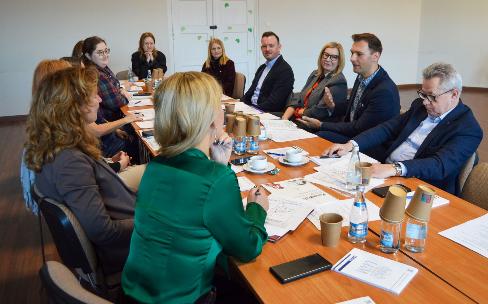 photograph: a group of twelve people around a conference table in a seminar room