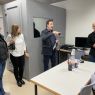 photograph: a group of four people standing in a laboratory