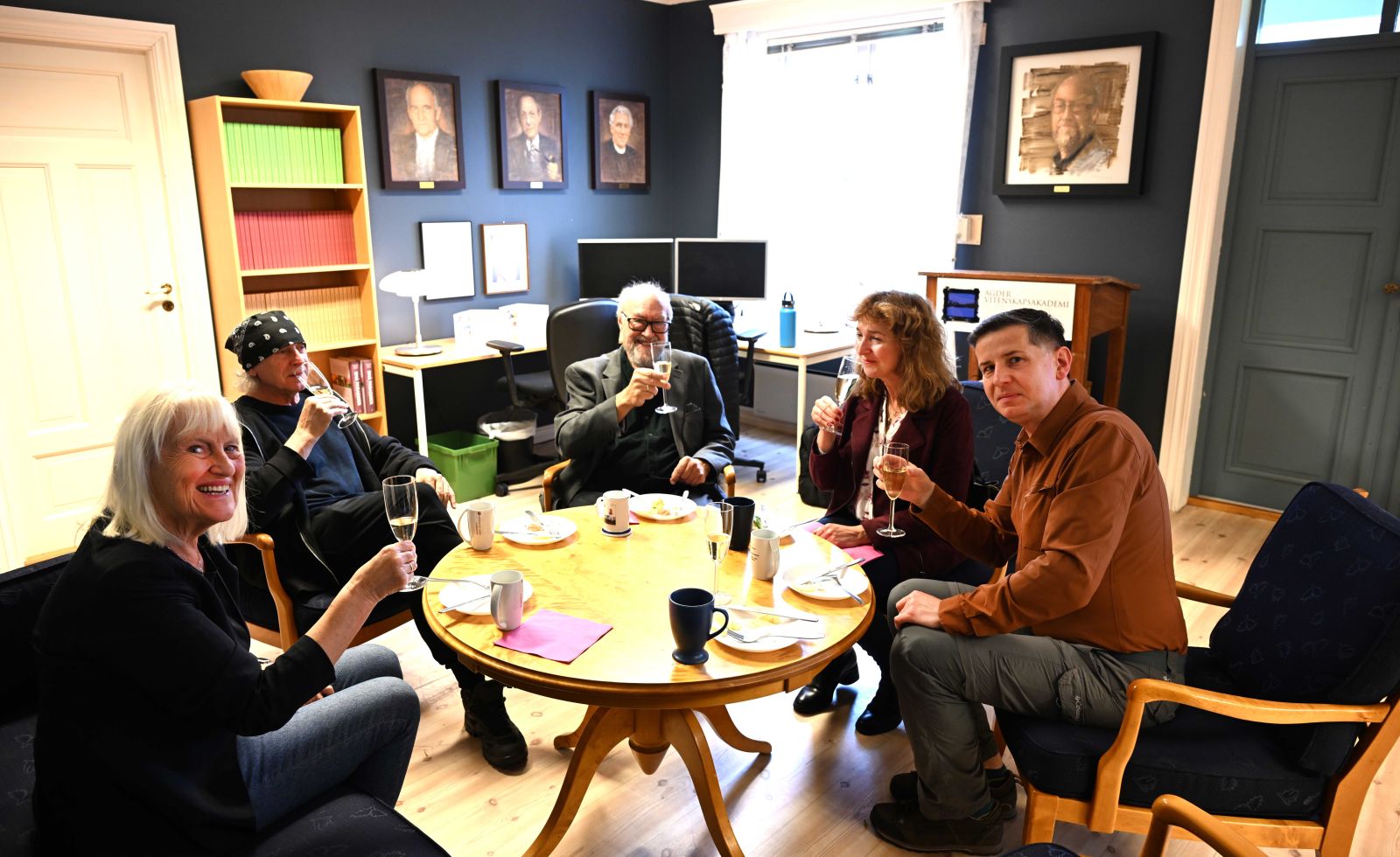 photograph: five people in a friendly meeting