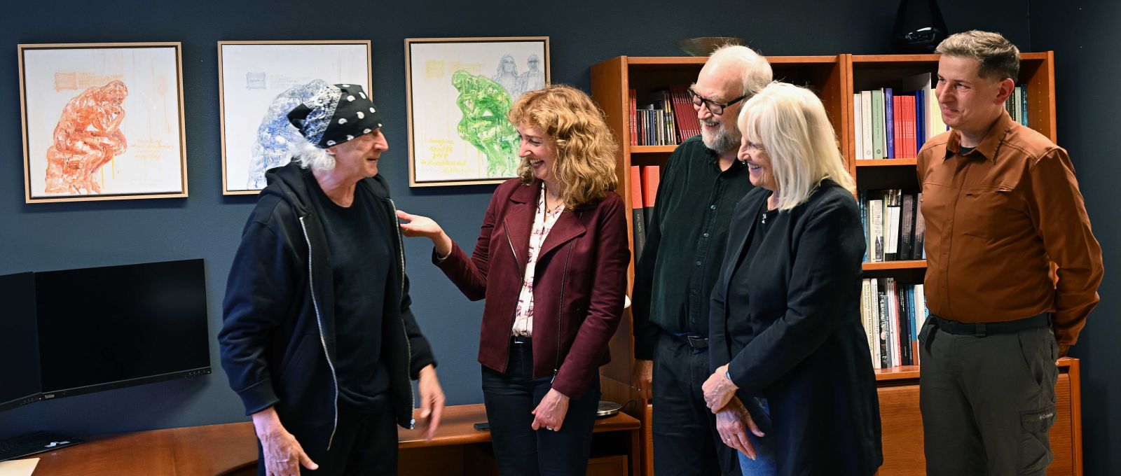 photograph: five people in a friendly meeting