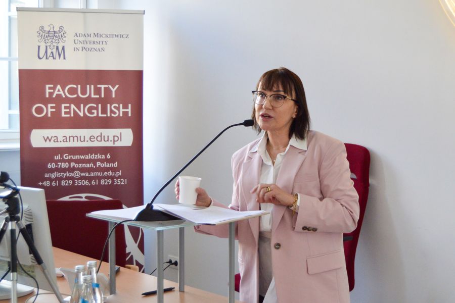 photograph: person talks from behind a pulpit in a lecture hall
